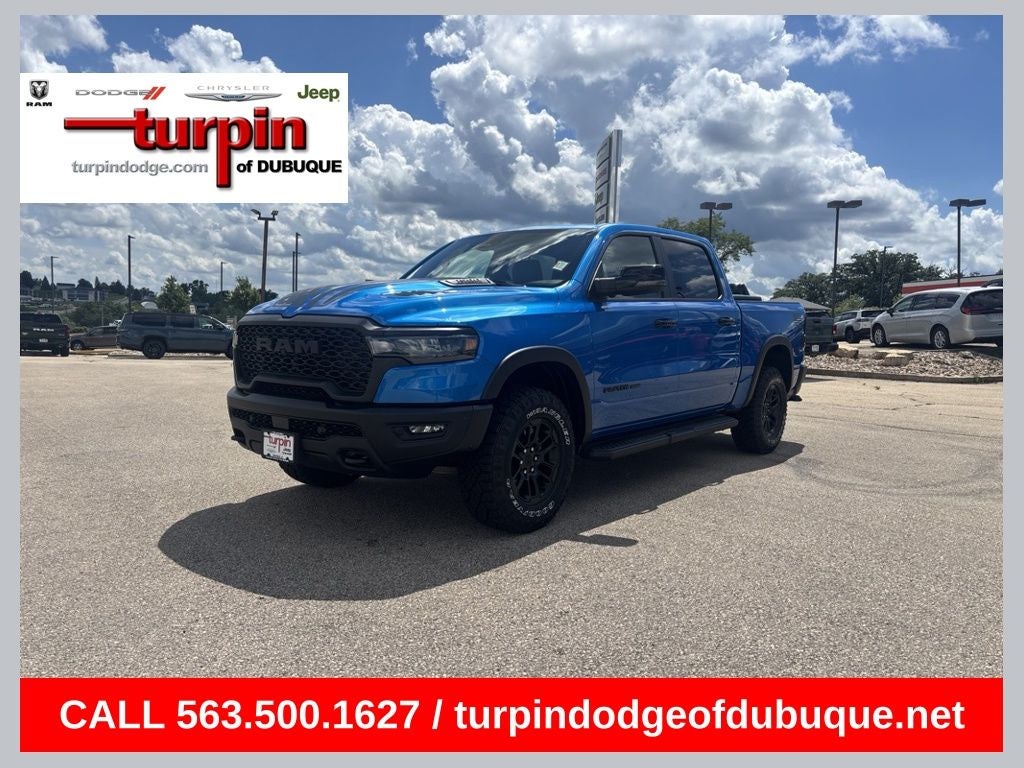 2026 RAM 1500 Rebel in Hydro Blue Pearlcoat — front three-quarter view