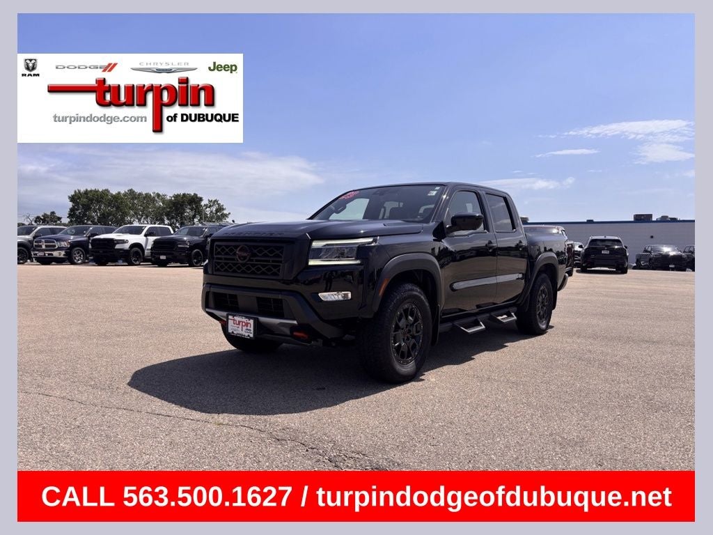 2023 Nissan Frontier PRO-4X in Super Black — front three-quarter view
